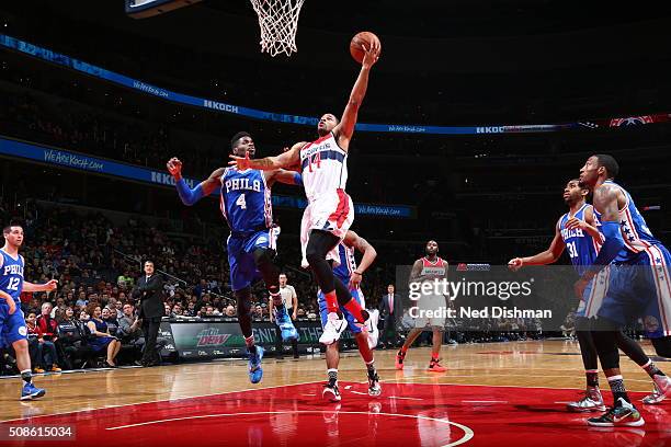 Gary Neal of the Washington Wizards goes to the basket against Nerlens Noel of the Philadelphia 76ers on February 5, 2016 at Verizon Center in...