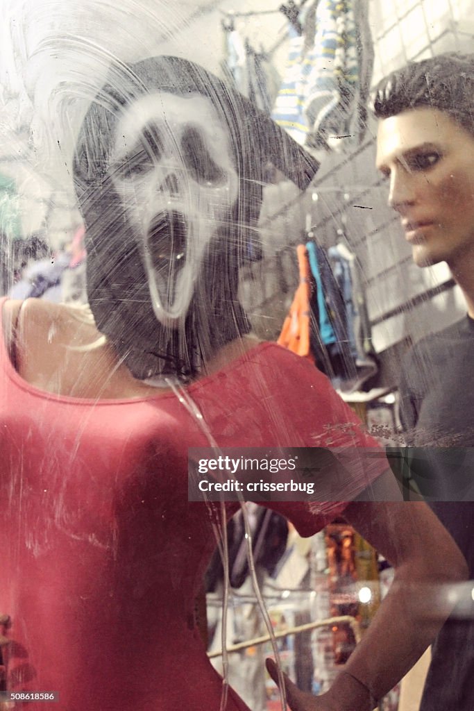 Ghostface "Scream" Mask Behind Dirty Glass