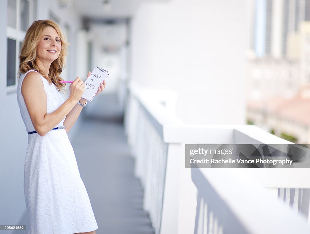 One woman with note pad and pencil