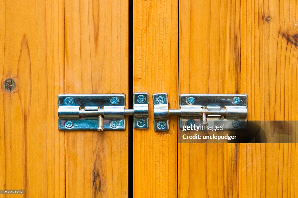 Steel slide locks on wooden door