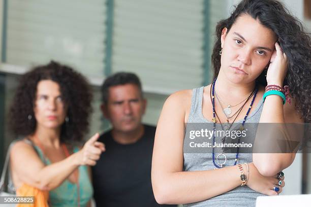 scolding their daughter - parents arguing stock pictures, royalty-free photos & images