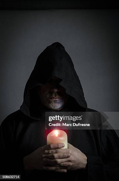 head shot of a black monk - paranormal stock pictures, royalty-free photos & images