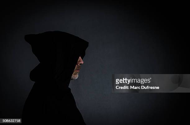 head shot of a black monk - sect stockfoto's en -beelden