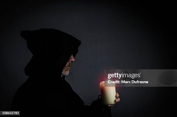 head shot of a black monk - sect stockfoto's en -beelden