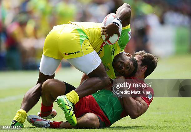 Henry Speight of Australia is tackled by Tiago Fernandes of Portugal during the 20146 Sydney Sevens match between Australia and Portugal at Allianz...