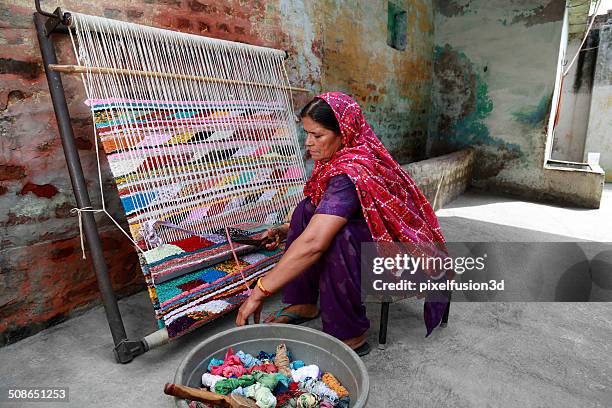 indian women weaving textile (durry) . - weave stock pictures, royalty-free photos & images
