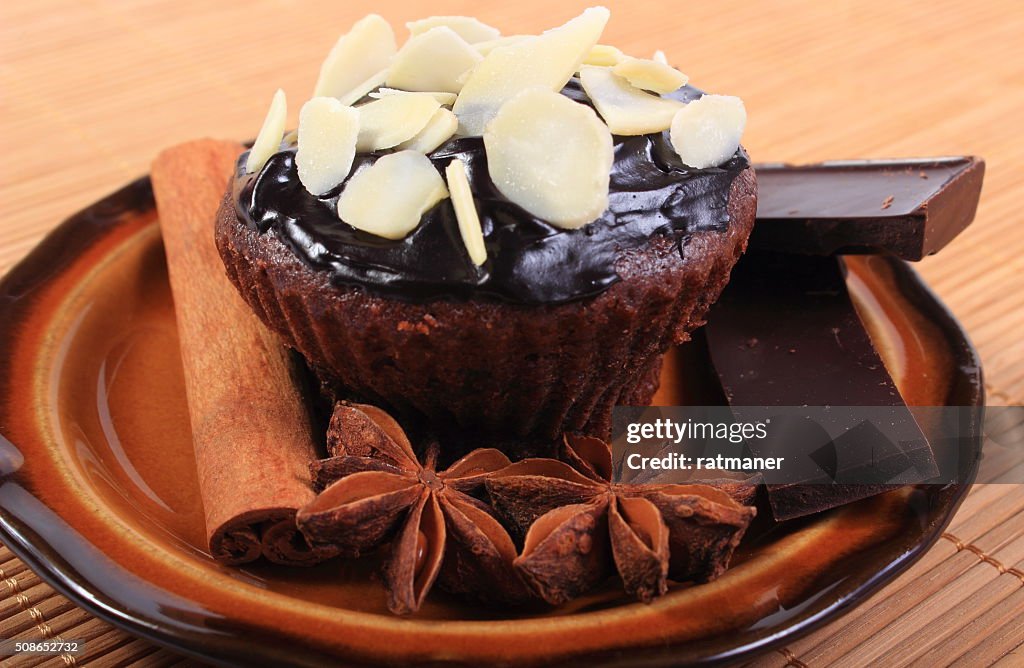 Baked muffins with pieces of chocolate, anise and cinnamon