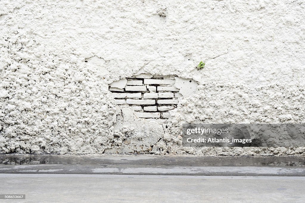 Damaged of white brick wall