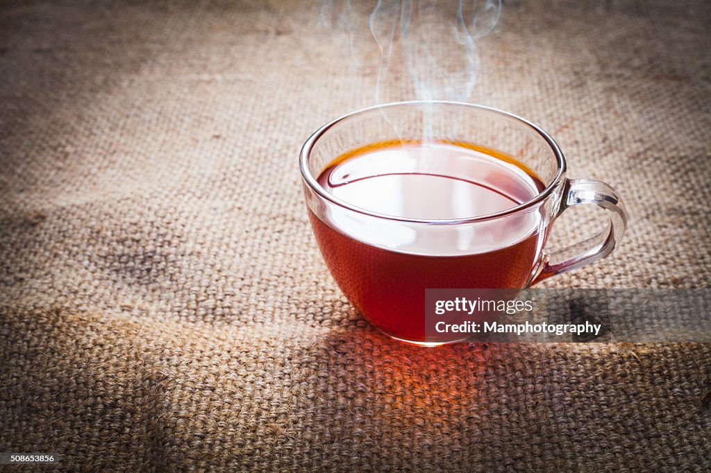 Cup of tea  on brown sack background