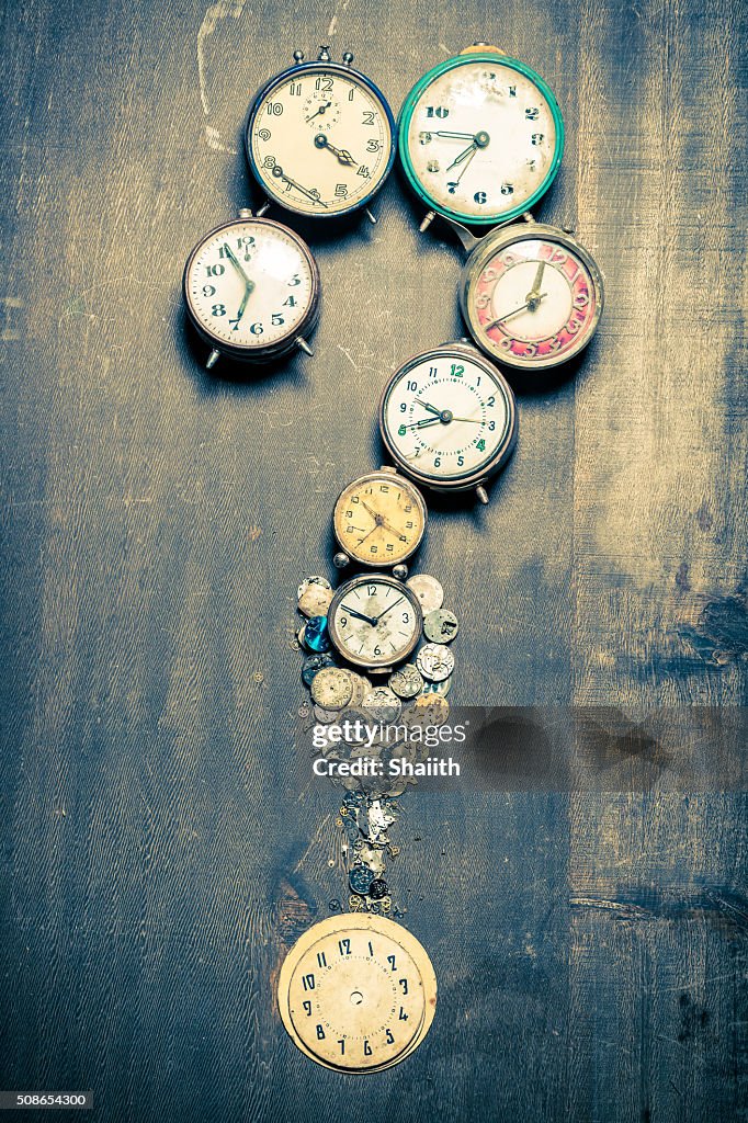 Questions mark arranged by clocks