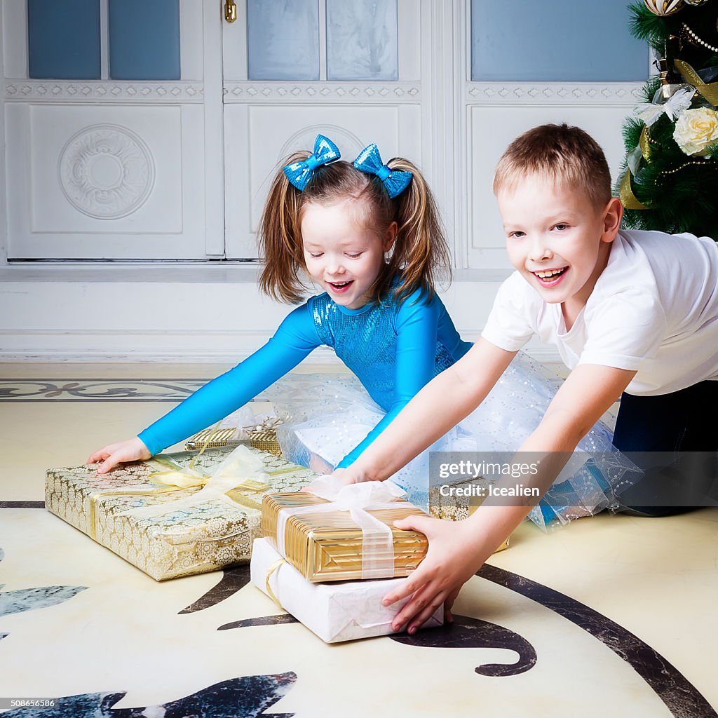 Portrait of a boy and girl  near the tree