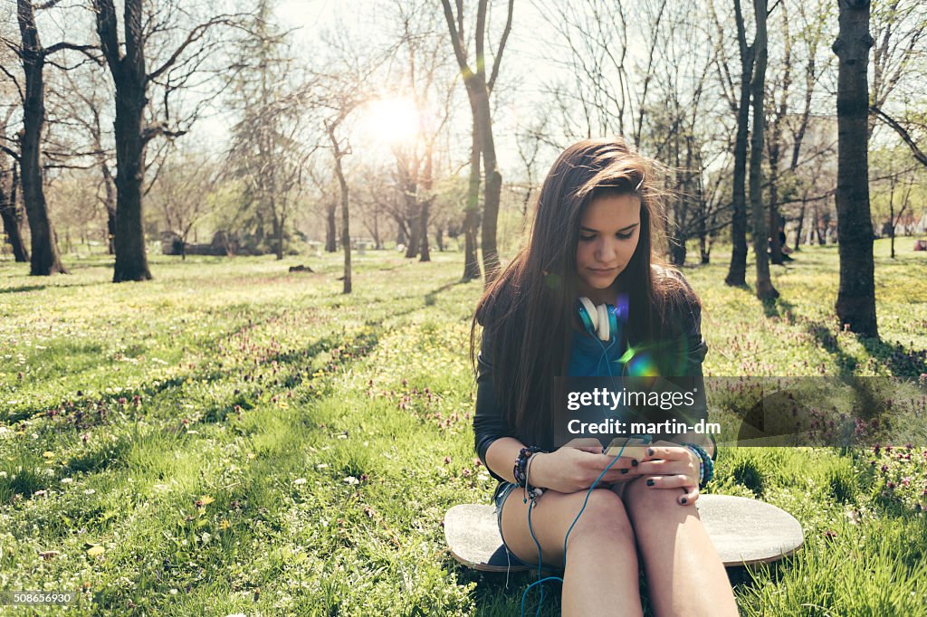 Girl texting outside