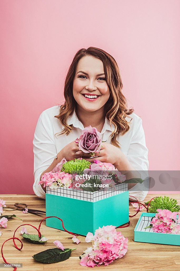 Happy woman with valentines flowers gifts