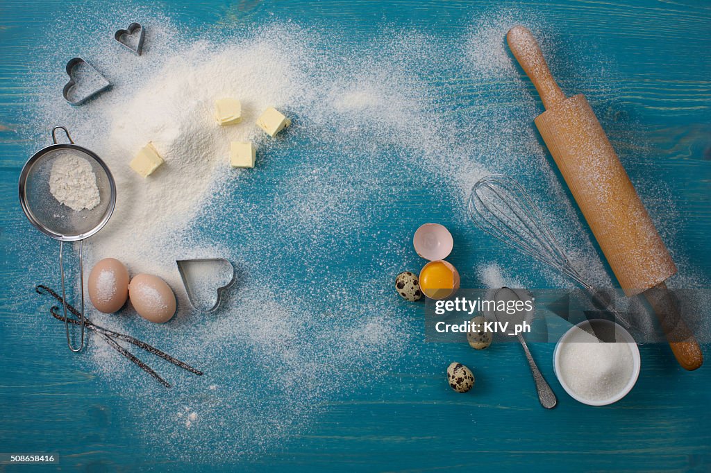 Tools and ingredients for baking vanilla cookies