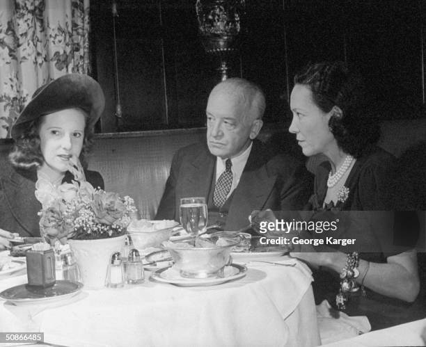 Lady Charles Cavandish dining with friends at the 21 Club.
