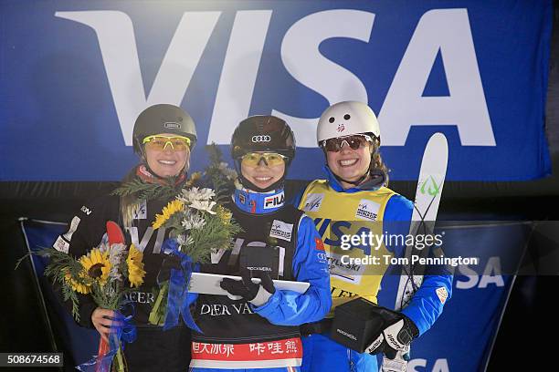 Danielle Scott of Australia in second place, Xin Zhang of China in first place and Ashley Caldwell in third place celebrate on the podium in the...