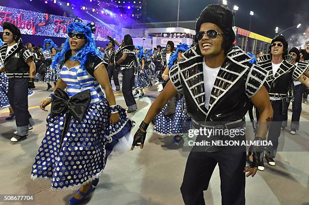 Revelers of the Rosas de Ouro samba school perform during the first night of the carnival parade at the Sambadrome in Sao Paulo, Brazil, on February...