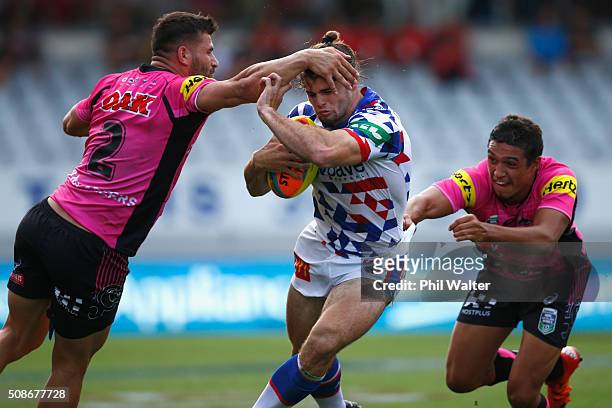 Jake Mamo of the Newcastle Knights is tackled during the 2016 Auckland Nines match between the Newcastle Knights and the Penrith Panthers at Eden...
