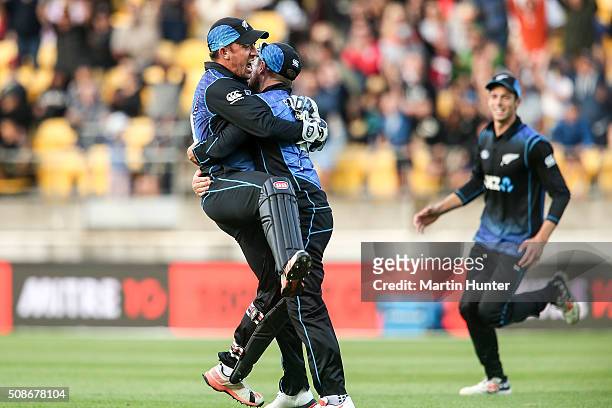 Luke Ronchi of New Zealand is hugged by Brendon McCullum after holding a catch to dismiss Steve Smith of Australia during game two of the one day...