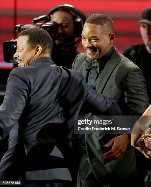 Actor Will Smith congratulates Terrence Howard in the audience during the 47th NAACP Image Awards presented by TV One at Pasadena Civic Auditorium on...