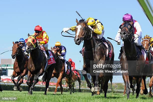 Nicholas Hall riding Puritan defeats Mark Zahra riding Golden Spin and Glenn Boss riding Ready for Victory in Race 8, the Manfred Stakes during...