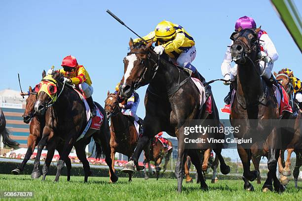 Nicholas Hall riding Puritan defeats Mark Zahra riding Golden Spin and Glenn Boss riding Ready for Victory in Race 8, the Manfred Stakes during...