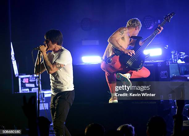 Musicians Anthony Kiedis and Flea of the Red Hot Chili Peppers perform onstage during the 'Feel The Bern' fundraiser concert to benefit presidential...