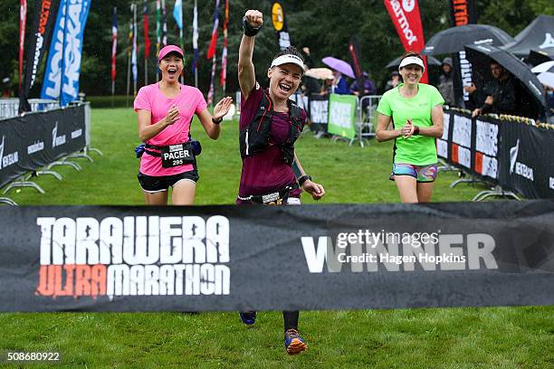 Fiona Hayvice of New Zealand celebrates while crossing the finish line to win the Tarawera Ultramarathon on February 6, 2016 in Rotorua, New Zealand.