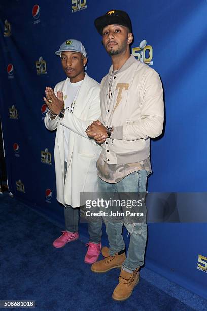 Winning artist Pharrell and Swizz Beatz arrive at Pepsi Super Friday Night at Pier 70 on February 5, 2016 in San Francisco, California.