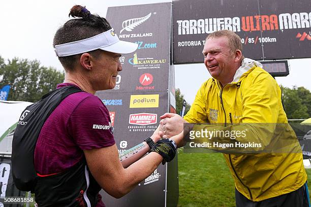 Fiona Hayvice of New Zealand celebrates with organiser Paul Charteris during the Tarawera Ultramarathon on February 6, 2016 in Rotorua, New Zealand.