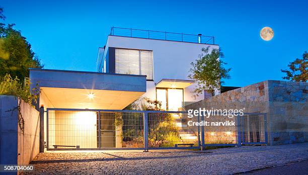 modern family house exterior by twilight - parking entrance stock pictures, royalty-free photos & images