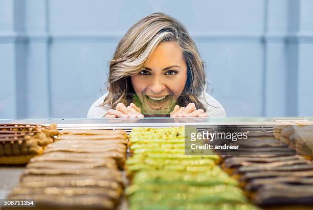 happy woman at a pastry shop - bakery window stock pictures, royalty-free photos & images