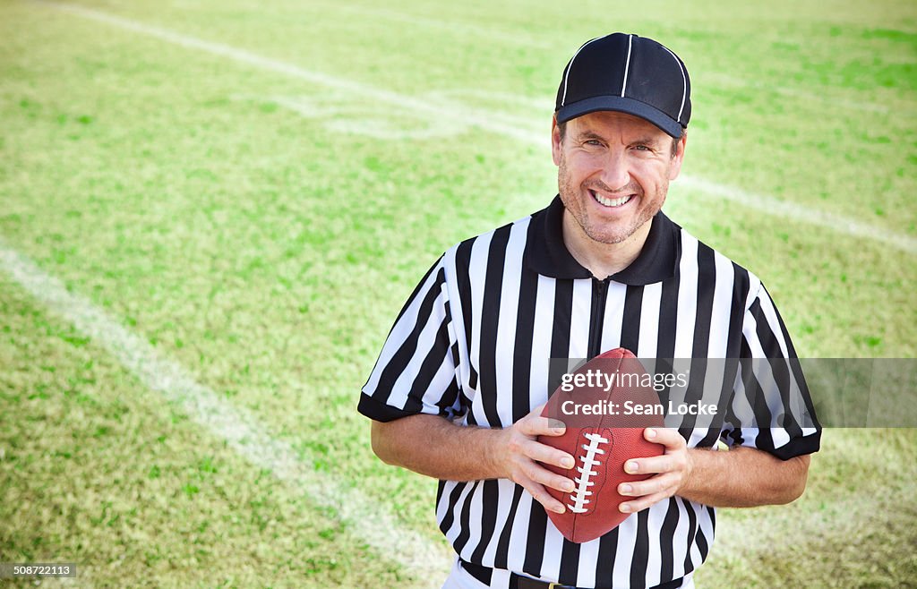 Referee: Holding a Football