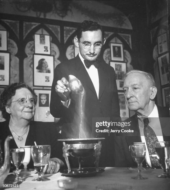 Tourist couple having lunch at Antonie's Restaurant.