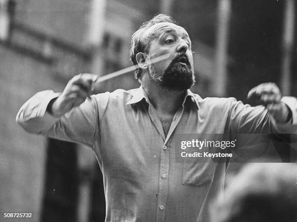 Polish composer Krzysztof Penderecki pictured conducting an orchestra, 1980.