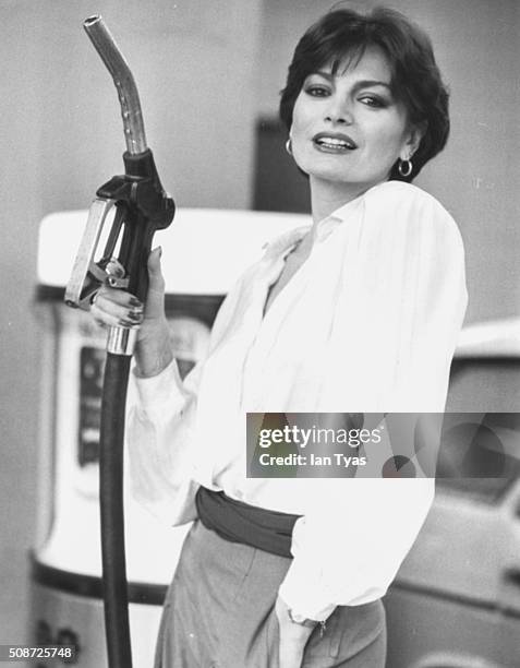 Turkish singer Ajda Pekkan, soon appearing at the Eurovision Song Contest, pictured pumping gas at a petrol station on Park Lane, London, March 17th...