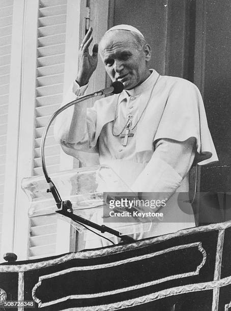 Pope John Paul II speaking from the balcony of the Papal Palace at Castel Gandolfo, circa 1980.