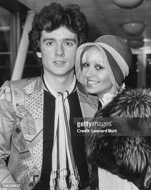 Actress Adrienne Posta pictured with her fiance, singer Graham Bonnet, as they prepare to fly to Los Angeles at London Airport, March 15th 1974.