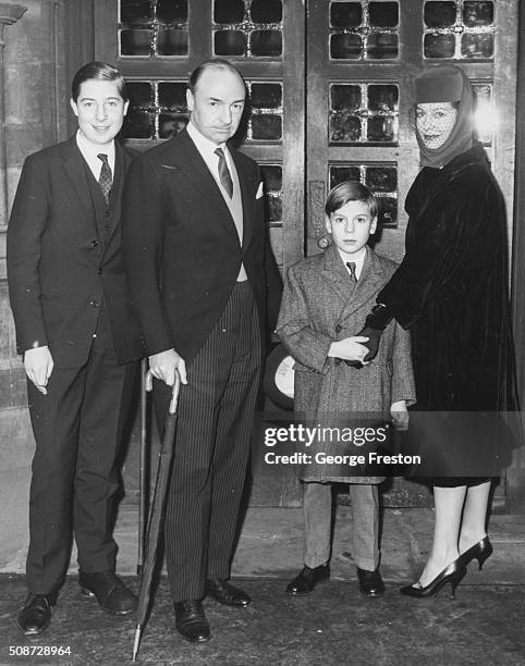 Politician John Profumo with his wife Valerie Hobson and their two sons, attending the wedding of Marcia Hare and Michael Hare at St Bartholomew's...