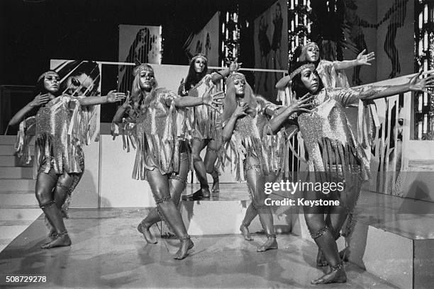 British television dance troupe Pan's People dressed in gold, with gold body paint, during the Christmas episode of BBC show 'Top of the Pops', 1968.