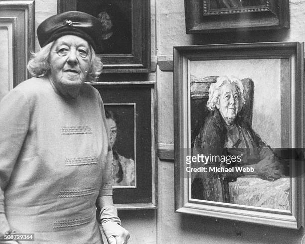Actress Margaret Rutherford pictured viewing a portrait of herself, painted by Michael Noakes RP, at the Royal Society of Portrait Painters annual...