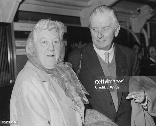 Actress Margaret Rutherford and her husband, actor Stringer Davis, preparing to leave for the USA to appear in a play, at London Airport, August 16th...