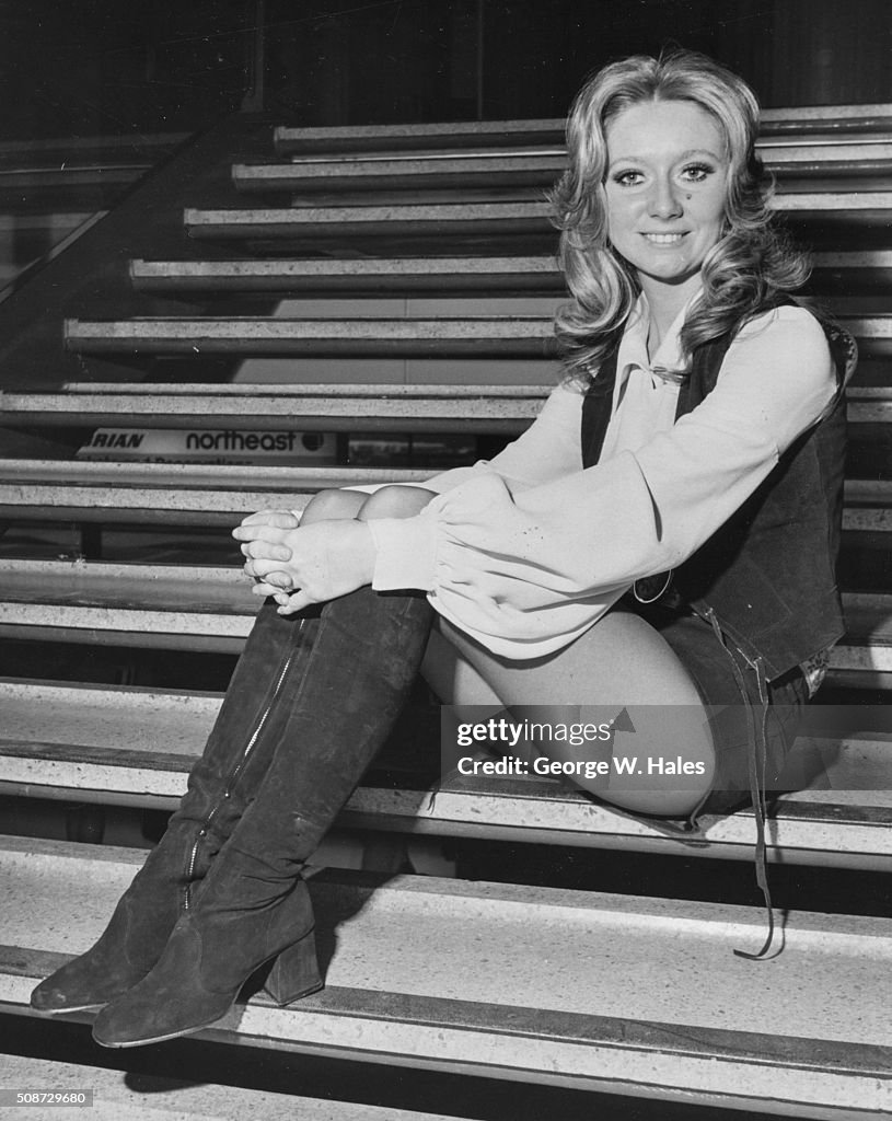 Cloder Rodgers Portrait of singer Clodagh Rodgers sitting on a staircase at Heathrow ...