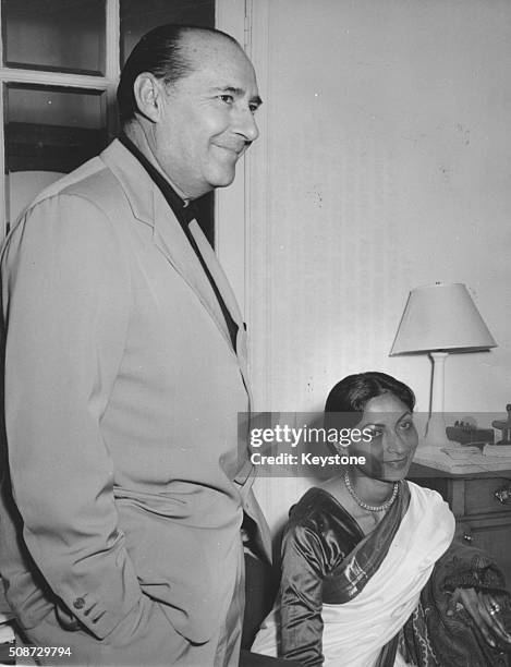 Film director Roberto Rossellini and writer Sonali Das Gupta pictured in the Carlton Hotel as they attend the Cannes Film Festival, France, May 1959.