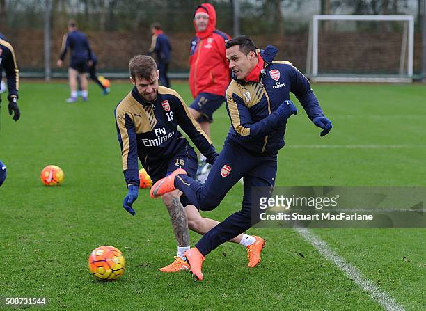 Aaron Ramsey and Alexis Sanchez of Arsenal during a training session at London Colney on February 6, 2016 in St Albans, England.