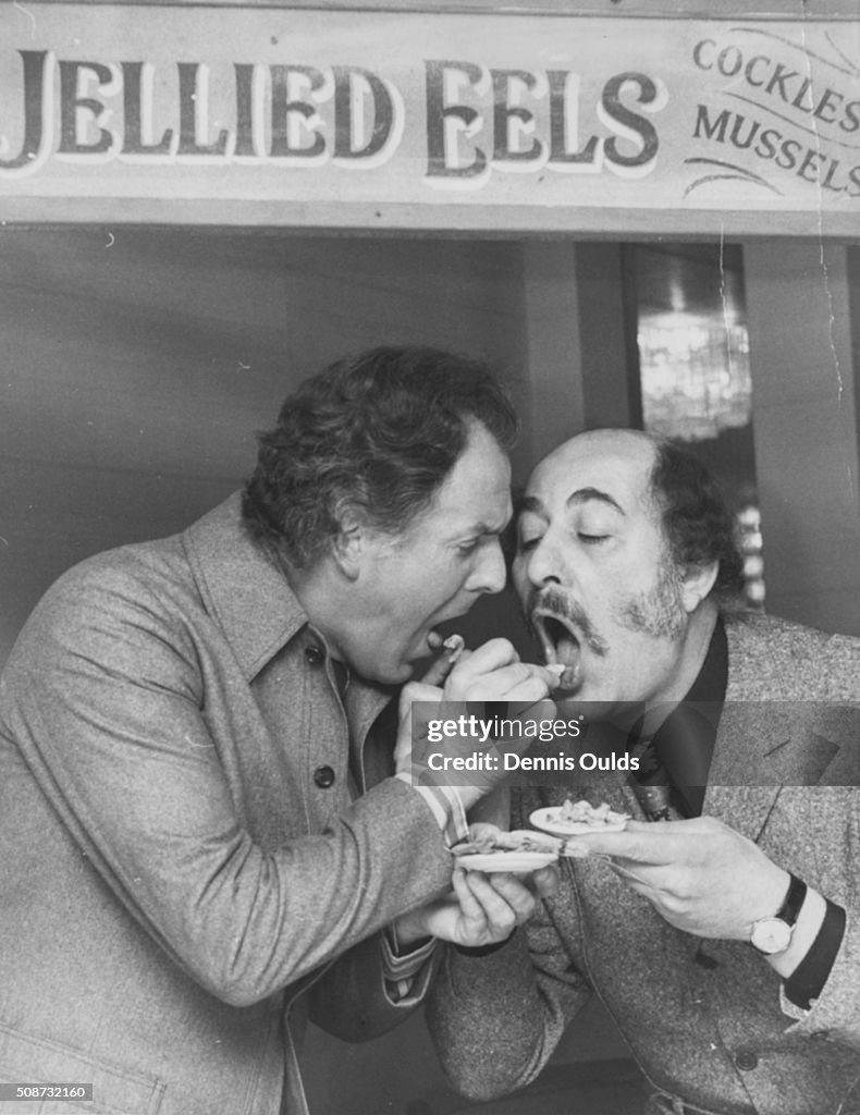 Brian Rix Actors Brian Rix and Alfred Marks feeding each other jellied eels at ...