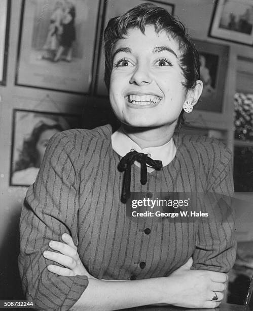 Actress Sandra Caron, sister of singer Alma Cogan, smiling as she attends he Aida Foster Stage School in London, November 22nd 1955.