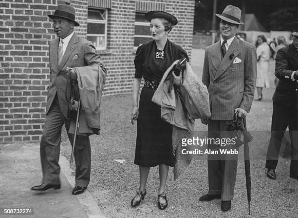 Lord Carnarvon and Prince Aly Khan with a female friend attending Goodwood Races, England, July 28th 1937.
