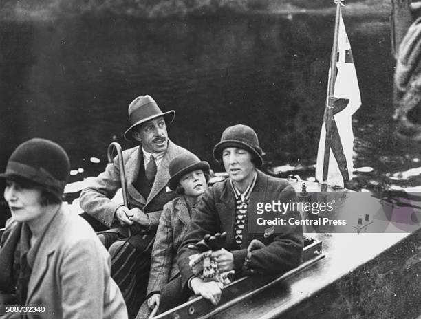 King Alfonso XIII of Spain with the Duchess of Sutherland , Lady Londonderry and young Lady Mary Stewart riding on a boat on a loch in Scotland, 1934.