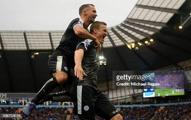 Robert Huth of Leicester City celebrates scoring his team's third goal with his team mate Danny Drinkwater during the Barclays Premier League match...